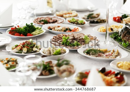 ストックフォト: Catering Service Restaurant Table With Food Huge Amount Of Food On The Table Plates Of Food Dinn