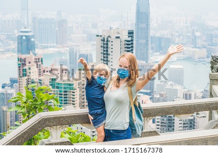 Zdjęcia stock: Mom And Son Travelers At The Peak Of Victoria Against The Backdrop Of Hong Kong Traveling With Chil