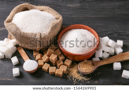 Stock photo: White Bowl Plates Of Natural White Sugar Cubes And Refined Sugar On Light Table Background