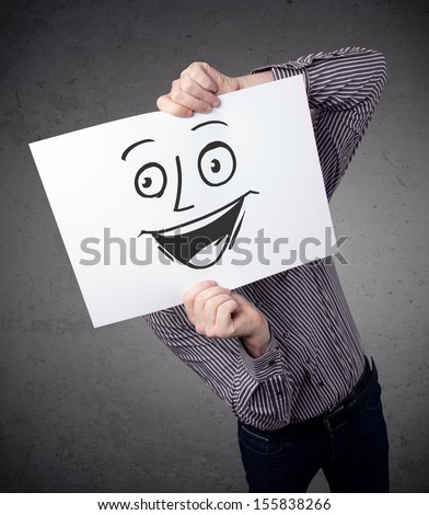 Foto stock: Businessman Holding Paper With Smiley Face In Front Of His Head