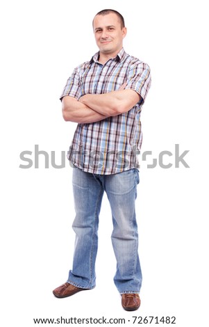 Stock foto: Full Length Portrait Of A Muscular Man Standing With Arms Folded Over White Background