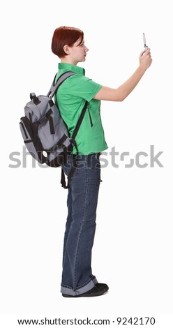 Foto stock: Concentrated Woman Using Photo Camera And Taking Pictures Near Window