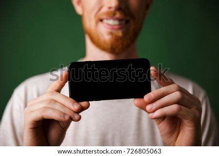 Zdjęcia stock: Cropped Photo Redhead Bearded Man In White Tshirt Makes A Photo