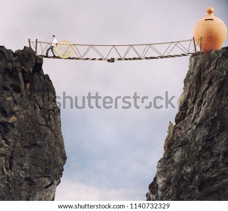 [[stock_photo]]: Businessman Moves A Coin Concept Of Difficulty To Saving Money