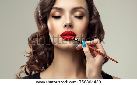 Stockfoto: Beauty Model With Makeup Brush Bright Make Up For Brunette Woma