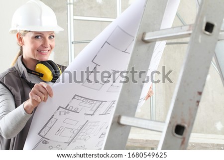 Stock photo: Construction Worker And Builder On Scaffolding Reading The Plan