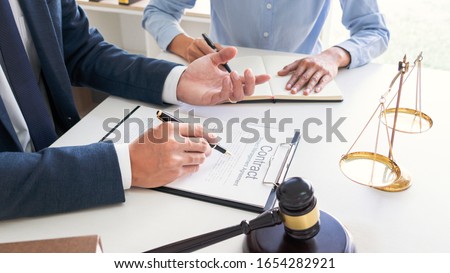 Stock photo: Male Lawyer Or Judge Consult With Client Check Contract Papers R