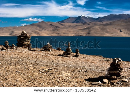 [[stock_photo]]: Buddhist Stone Pyramid At Morning Tso Moriri Lake Altitude 4600