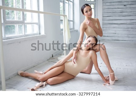 Stok fotoğraf: Young Beautiful Dancer In Beige Swimwear Posing On White Cube