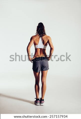 Stockfoto: Rear View Shot Of Healthy Young Woman In Sportswear Full Length Muscular Female Model Standing Agai