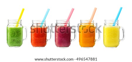 [[stock_photo]]: Freshly Blended Orange Citrus Smoothie In Glass Jars With Straw Mint Leaf Top View Close Up Whit