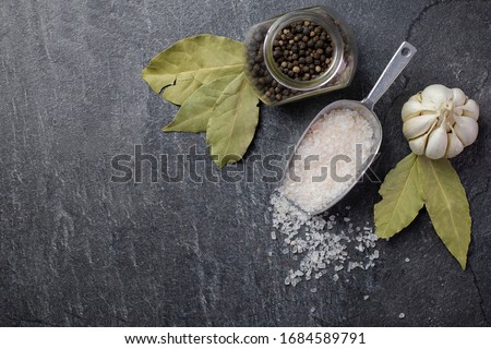 Сток-фото: Dark Culinary Background With Bay Leaves Salt Pepper And Garlic View From Above Copy Space For R