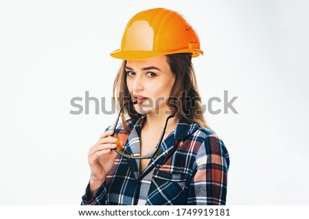 Stockfoto: Young Builder Girl In Chechered Shirt Glasses And White Shorts