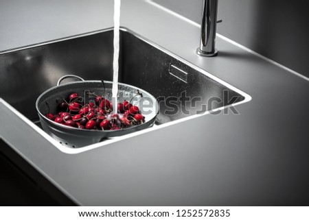 Сток-фото: Summer Ripe Sweet Cherry Berries In A Colander On A Color Background Of The Year 2019 Living Coral P