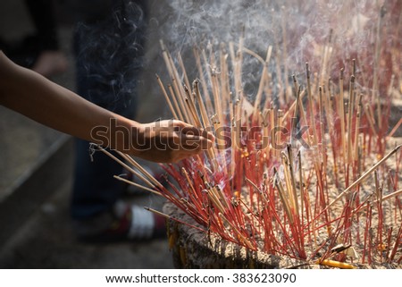 Stok fotoğraf: Incense Sticks On Joss Stick Pot Are Burning And Smoke Use For Pay Respect To The Buddha Incense St