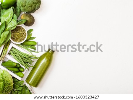 Stok fotoğraf: Assorted Green Toned Raw Organic Vegetables On White Stone Background Avocado Cabbage Broccoli C