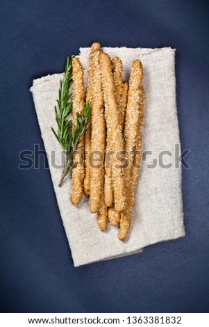 Stock foto: Italian Grissini Or Salted Bread Sticks With Rosemary Herb On Li