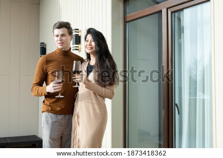 Foto d'archivio: Front View Of Young Asian Businessman Cheering During Seminar In Front Of Business Professionals Sit