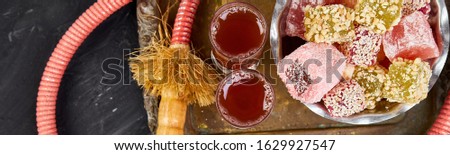 Stock foto: Banner Of Set Of Various Turkish Delight In Bowl On Metal Tray Near Hookah Tube