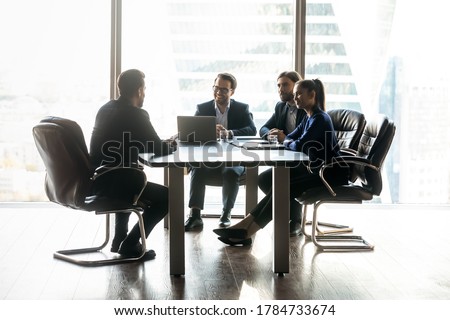 [[stock_photo]]: Professional Female Employer Enjoys Working Process Sits Crossed Legs With Laptop Device Chats Onl