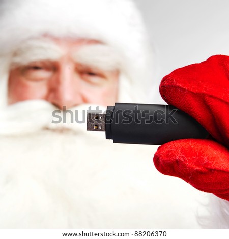 Zdjęcia stock: Traditional Santa Claus Holding 3g Usb Modem In His Arm On Foreg