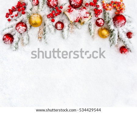 Foto d'archivio: Christmas Balls And Red Bow With Bells On Background Snowy Fir B