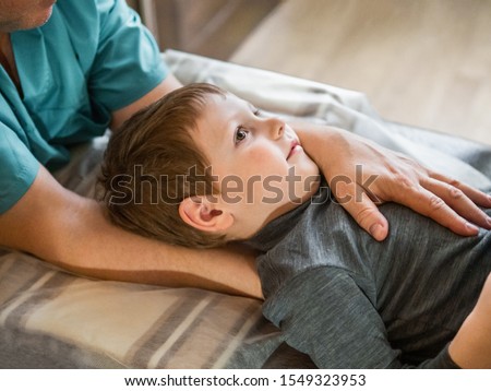 [[stock_photo]]: Alternative Medicine And Pain Healing Young Therapist With Pati