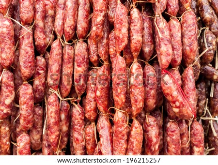 Stok fotoğraf: Hand Made Smoked Sausages For Sale Hanging At Asian Food Market