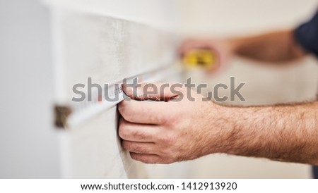 Foto stock: Builder With Tape Measure