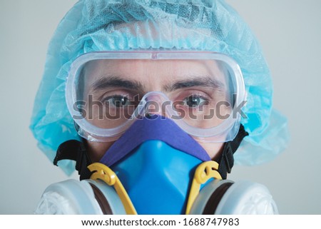 Stok fotoğraf: Portrait Of Focused Man Scientist In Protective Glasses Writing In Notepad