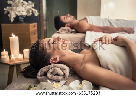 [[stock_photo]]: Beautiful Woman Lying Down On Massage Table In Luxury Wellness Center