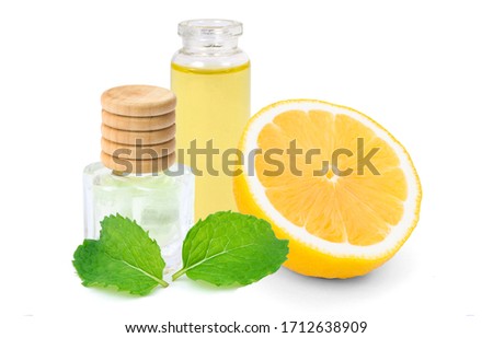 Foto stock: Bottles Of Essential Oil With Fresh Citrus Fruit Melissa Myrrh White Sandalwood
