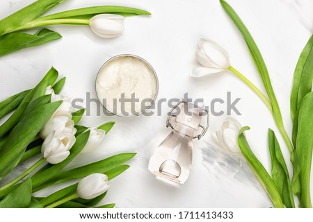 Сток-фото: Beauty Face Moisturizing Cream And Flower Petals On Marble Luxu