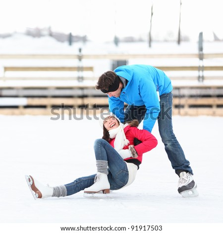 Foto stock: Ice Skating Couple Having Winter Fun On Ice Skates Quebec Canada