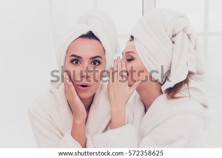 Foto stock: Happy Young Smiling Woman In White Bathrobe Talking To Her Husband Having Bath