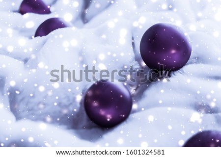 Foto stock: Violet Christmas Baubles On Fluffy Fur With Snow Glitter Luxury