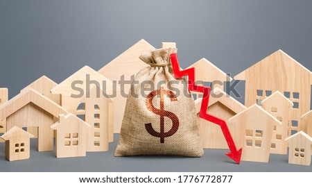 Сток-фото: City Residential Buildings And Dollar Money Bag With A Red Down Arrow Low Cost Of Real Estate Lowe