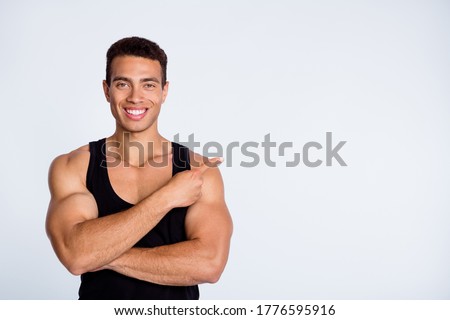 Foto stock: Young Attractive Male Body Builder With Advertising Copy Space Board Studio Shot White Isolated Ba