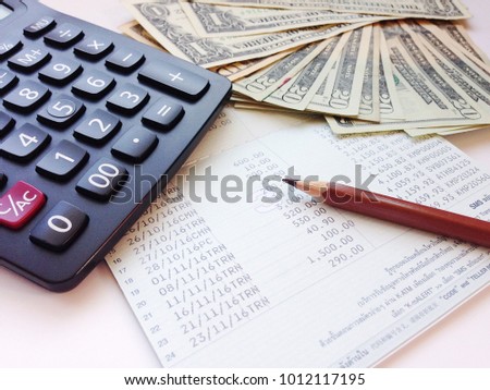 Stock photo: Tax Calculator And Dollar Bills