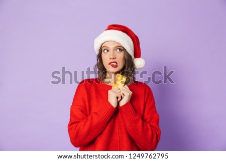 Stockfoto: Excited Young Woman Wearing Christmas Hat Posing Isolated Over Blue Wall Background Take A Selfie By