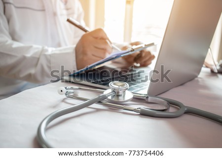 Stock foto: View Of Stethoscope And Equipment On Foreground Table With Docto