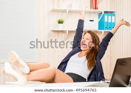 Stock fotó: Very Beautiful Business Woman Sits In An Office Chair And Plans Her Business For The Future