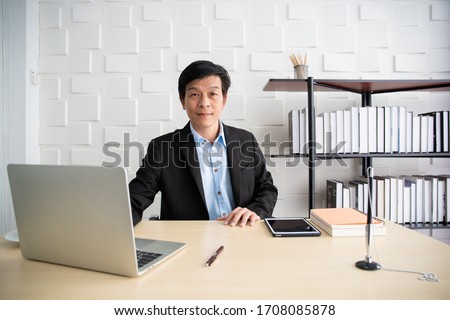 Foto stock: Portrait Of Elderly Smart Confident Man Sitting In His Armchair