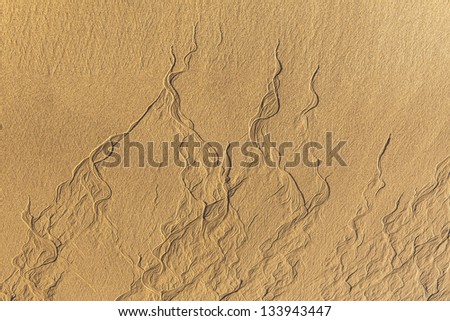 Foto stock: Islamic Pattern Type Texture On The Sand Beach While Low Tide Ti