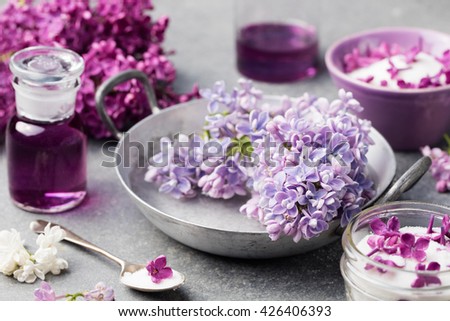 [[stock_photo]]: Lilac Flowers Sugar And Syrup Essential Oil With Flower Blossoms In Glass Jar Top View