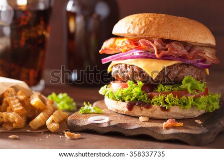 [[stock_photo]]: Fresh Beef Burger With Sauce And Vegetables And Glass Of Cola Soft Drink With Potato Chips Fries On