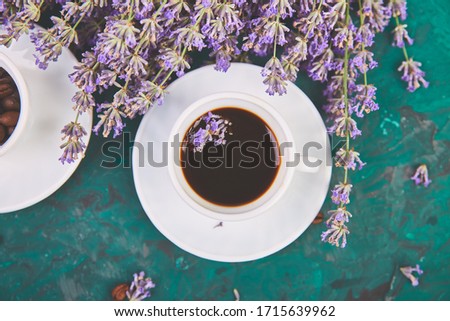 Сток-фото: Coffee Coffee Grain In Cups And Lavender Flower On Green Background