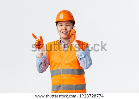 Stok fotoğraf: Confident Architect Talking On The Phone While Pointing At Computer Screen