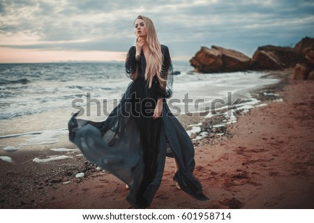 Woman In Black Dress On Beach Foto stock © Stasia04