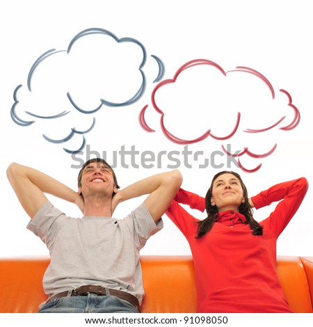 Stok fotoğraf: Smiling Beautiful Couple Sitting On A Sofa And Dreaming About Ne